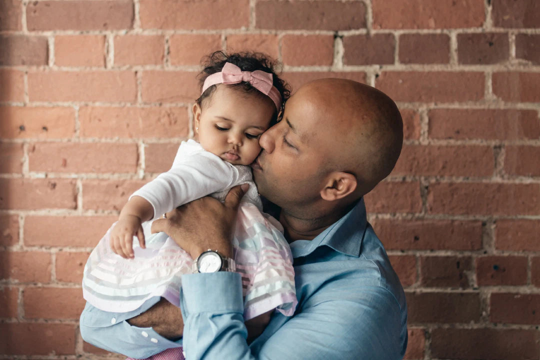 father-gives-baby-daughter-a-kiss-mob.webp
